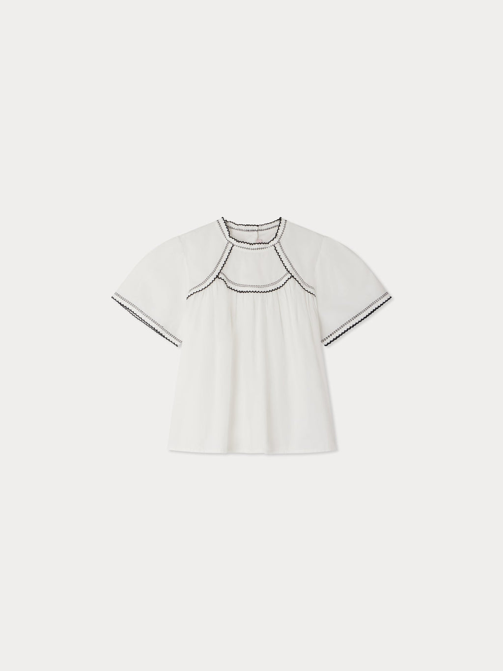 blouse à broderies contrastées