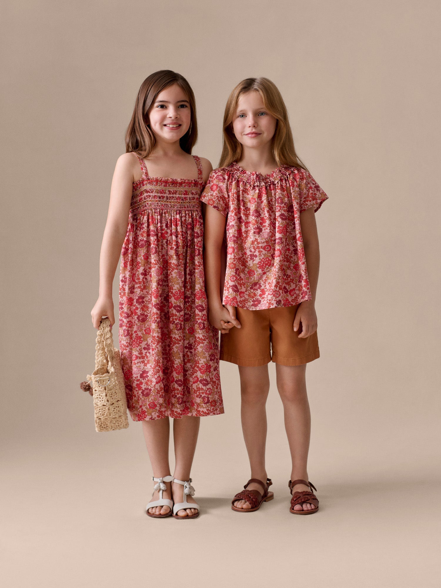 smocked and hand-embroidered dress in organic cotton fabric
