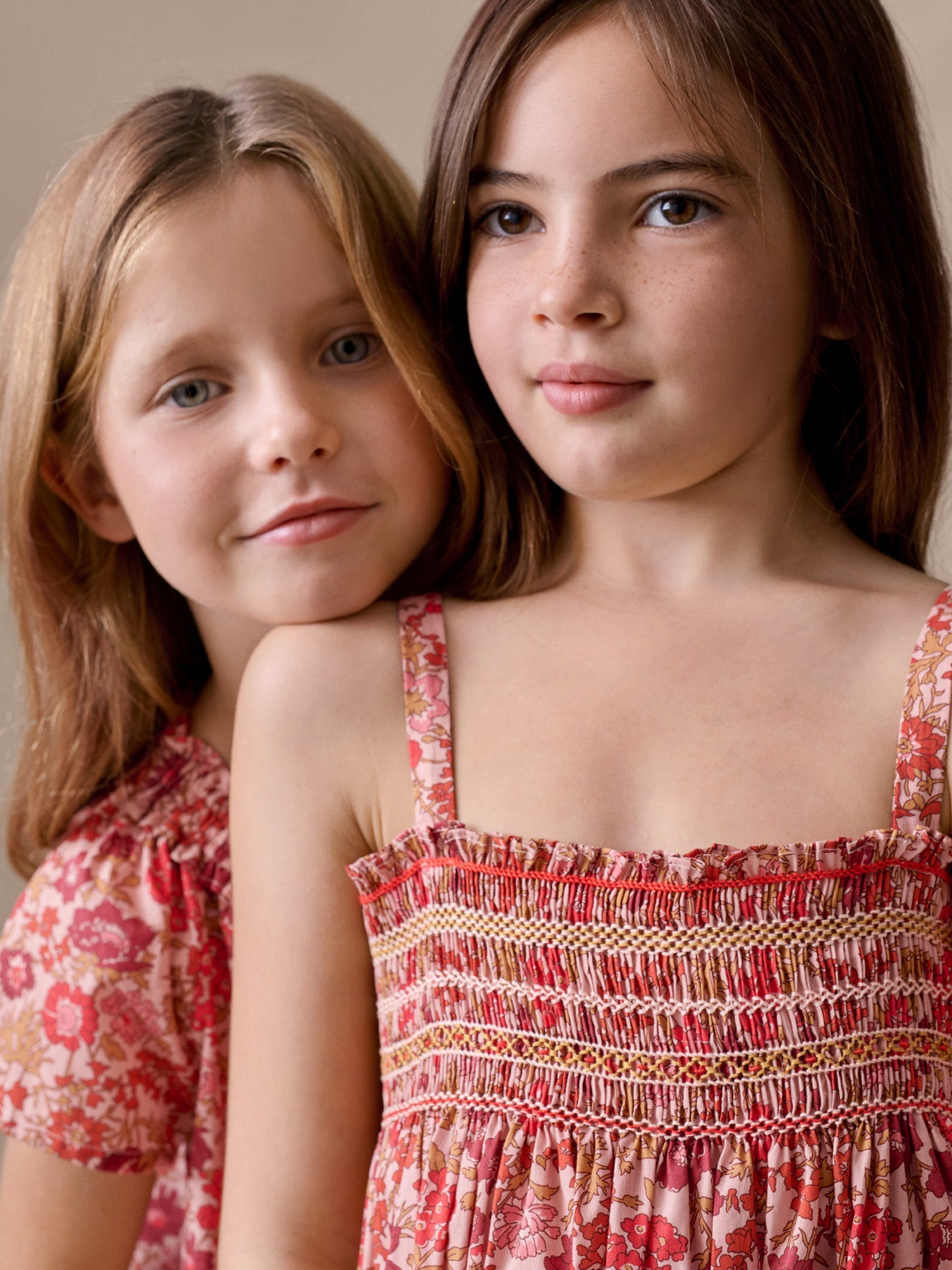smocked and hand-embroidered dress in organic cotton fabric