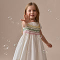 Robe smockée et brodée main en coton biologique, motif tie-dye